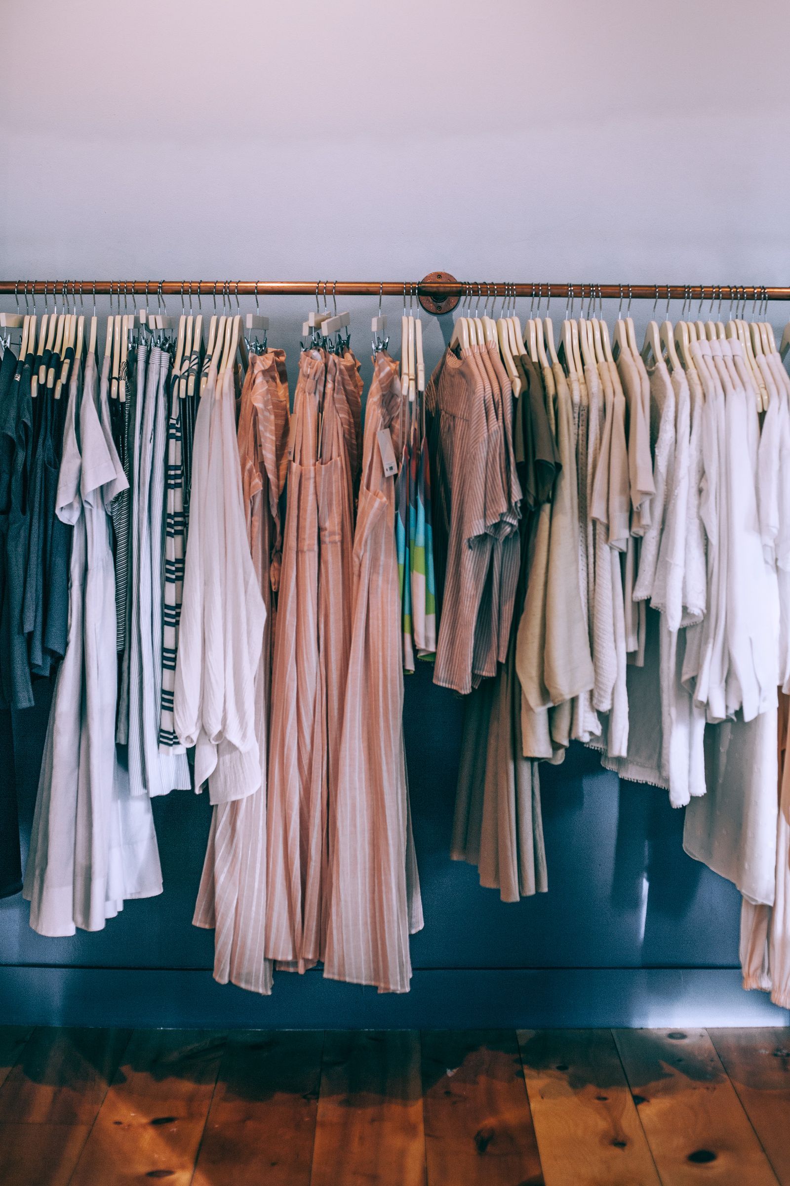 Natural-fibre clothing on a boutique rack