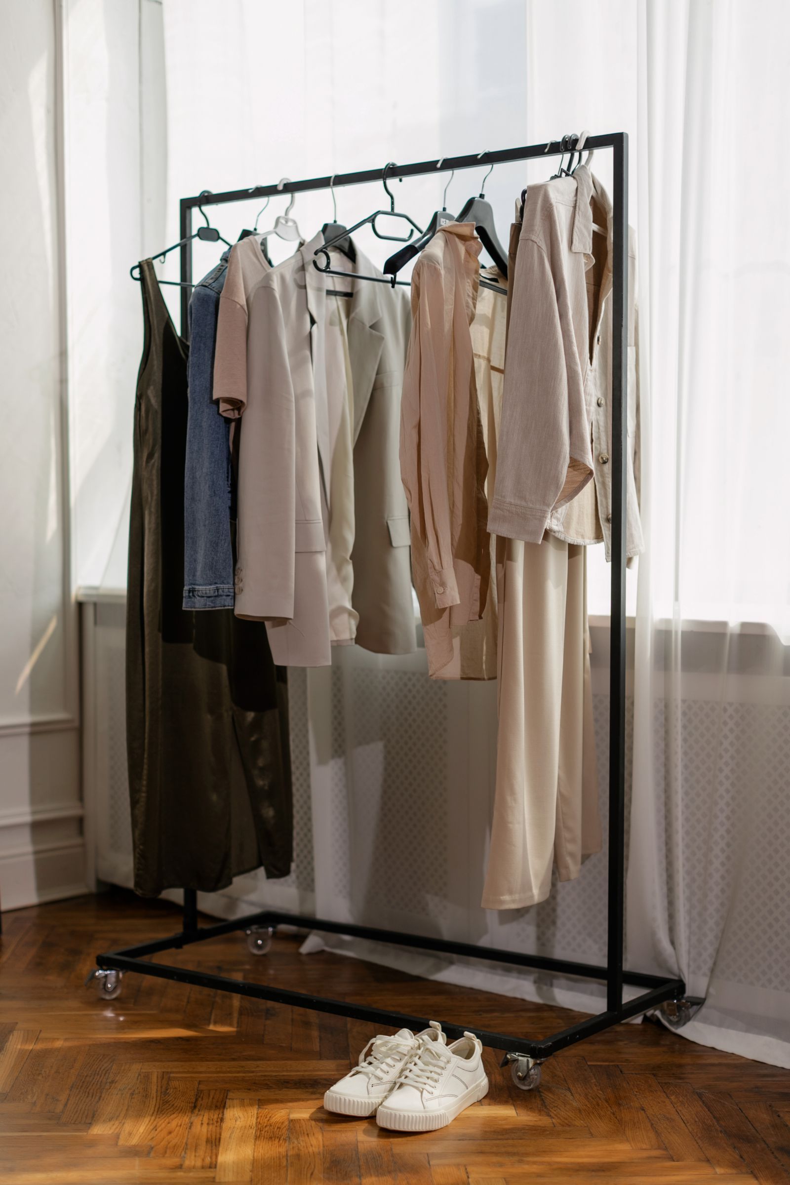 Neutral-toned garments on a rack
